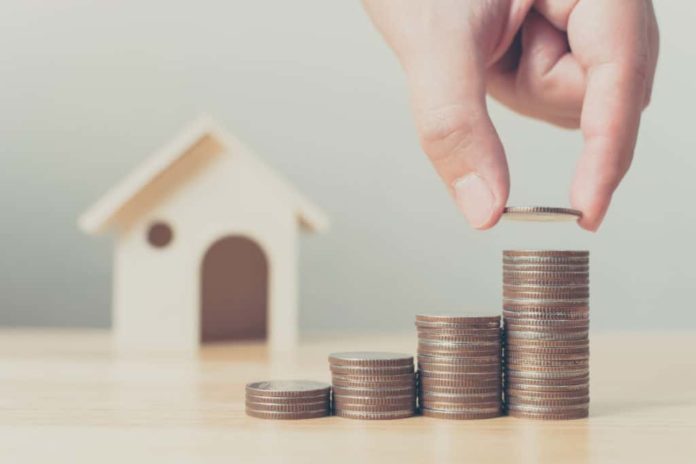 Yours, Mine and Ours – Texas Community Property Explained Coins stacked in columns with a house in the background.