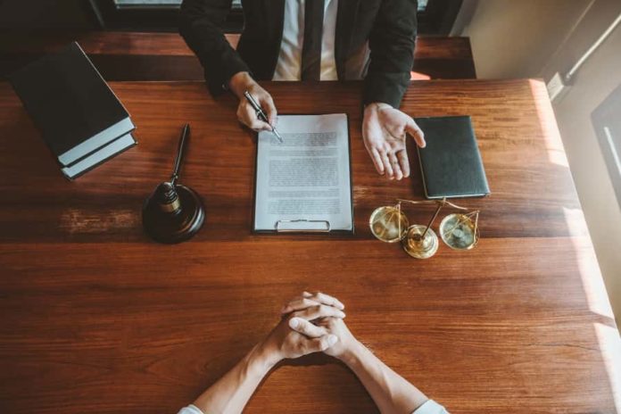 Attorney speaking with his client - It is Twenty Years Later - Do You Know Where Your Lawyer Is? - Hammerle Morris Law Firm