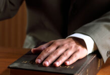hand on bible