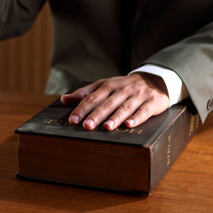 hand on bible