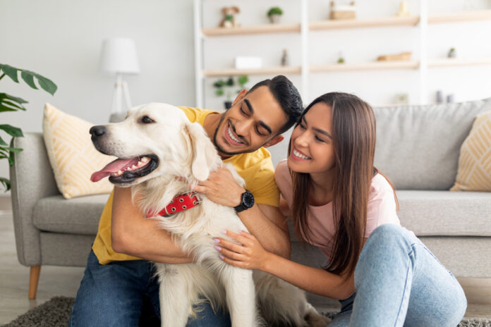 couple with their dog