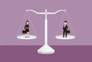 Businessman and businesswoman on the scale