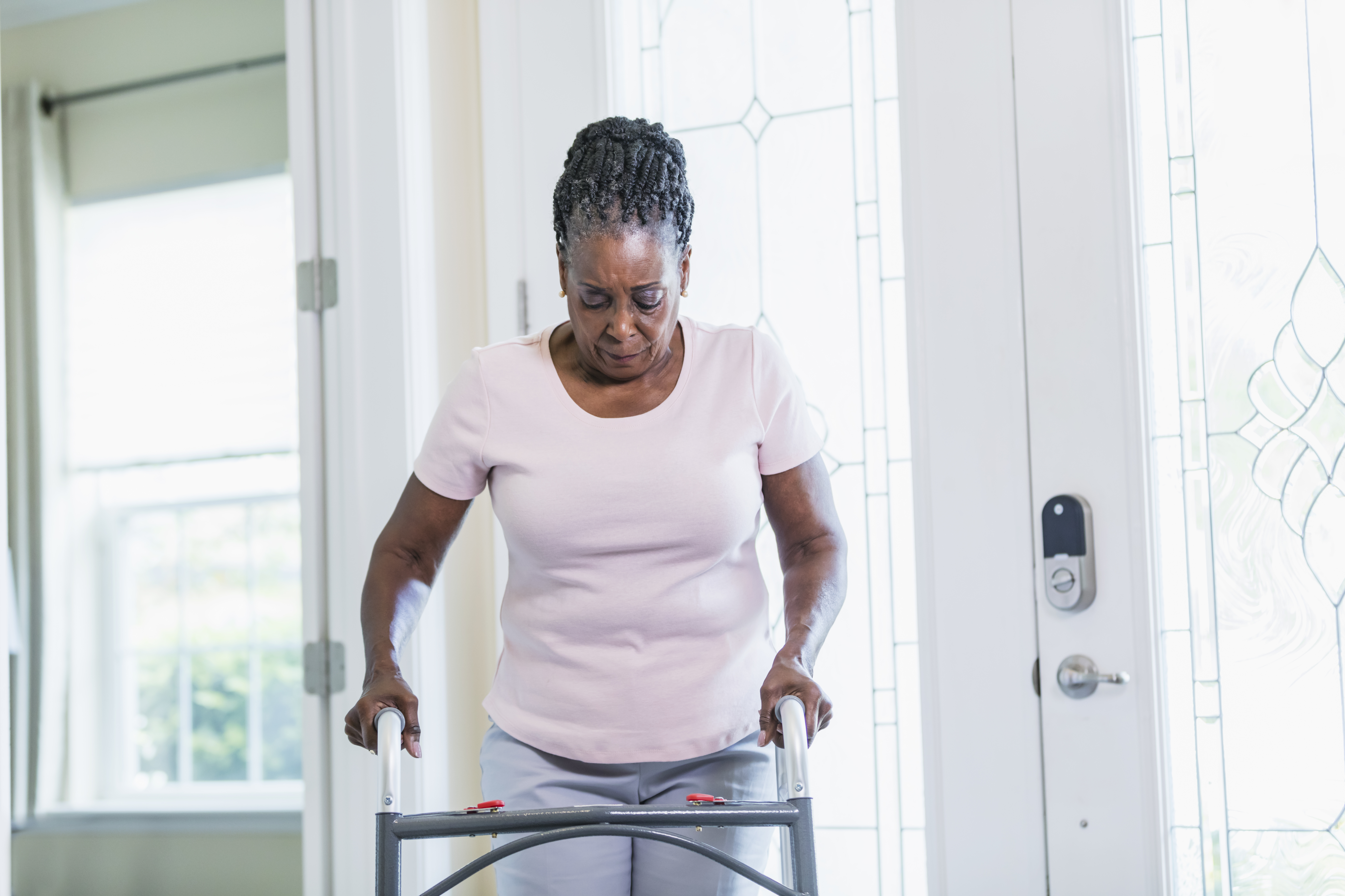 Senior woman using walker