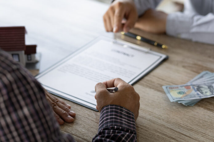 Real estate agents are discussing the terms of signing contracts, legal agreements, land purchases, mortgages and home rentals.