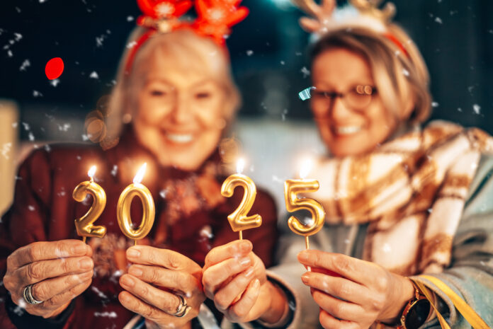 Two senior women are walking down the street with shopping bags, celebrating the arrival of the New Year together.
