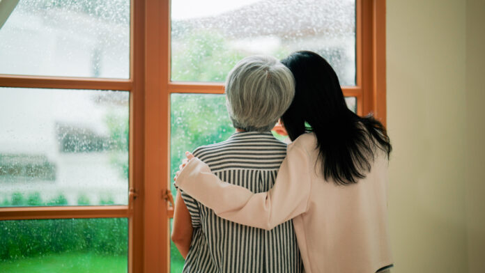 A young Asian woman spending time at home with her retired mother during weekend.