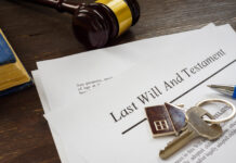 Last will and testament papers and key as symbol of property.